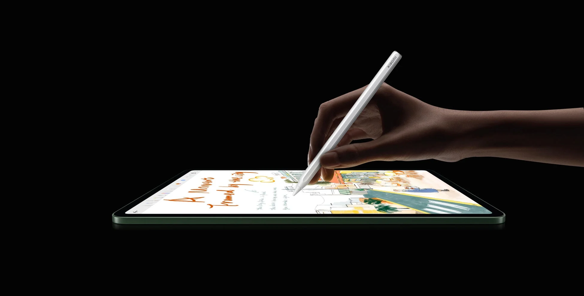 タブレットにペンで絵を描いている