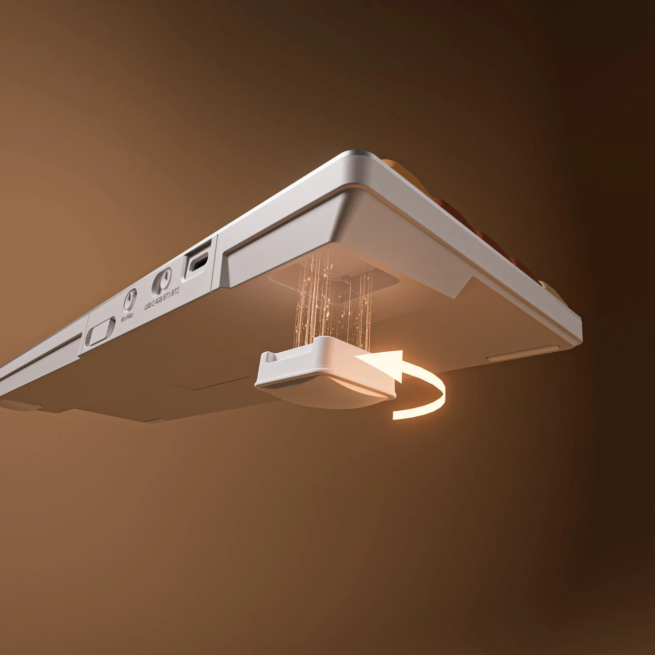 白い電子機器の裏側を写した画像で、マグネット式の取り付け部分とワイヤレス接続の多様性を示すテキストが表示