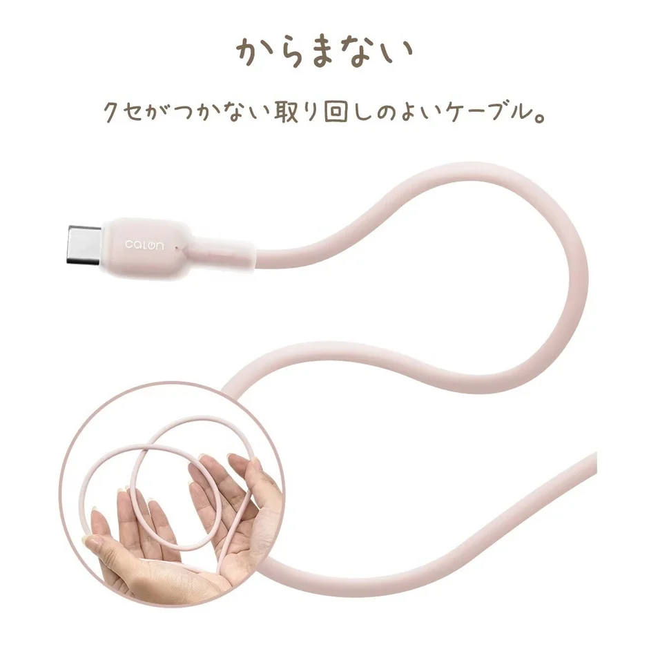 ピンク色のUSB-Cケーブルが手のひらで曲げられている様子